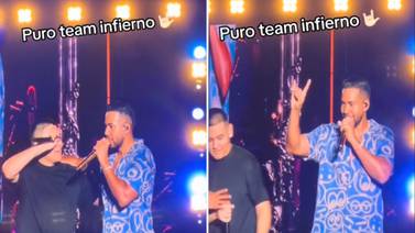 Romeo Santos se confunde con la señal de "team infierno" cuando fan sube al escenario