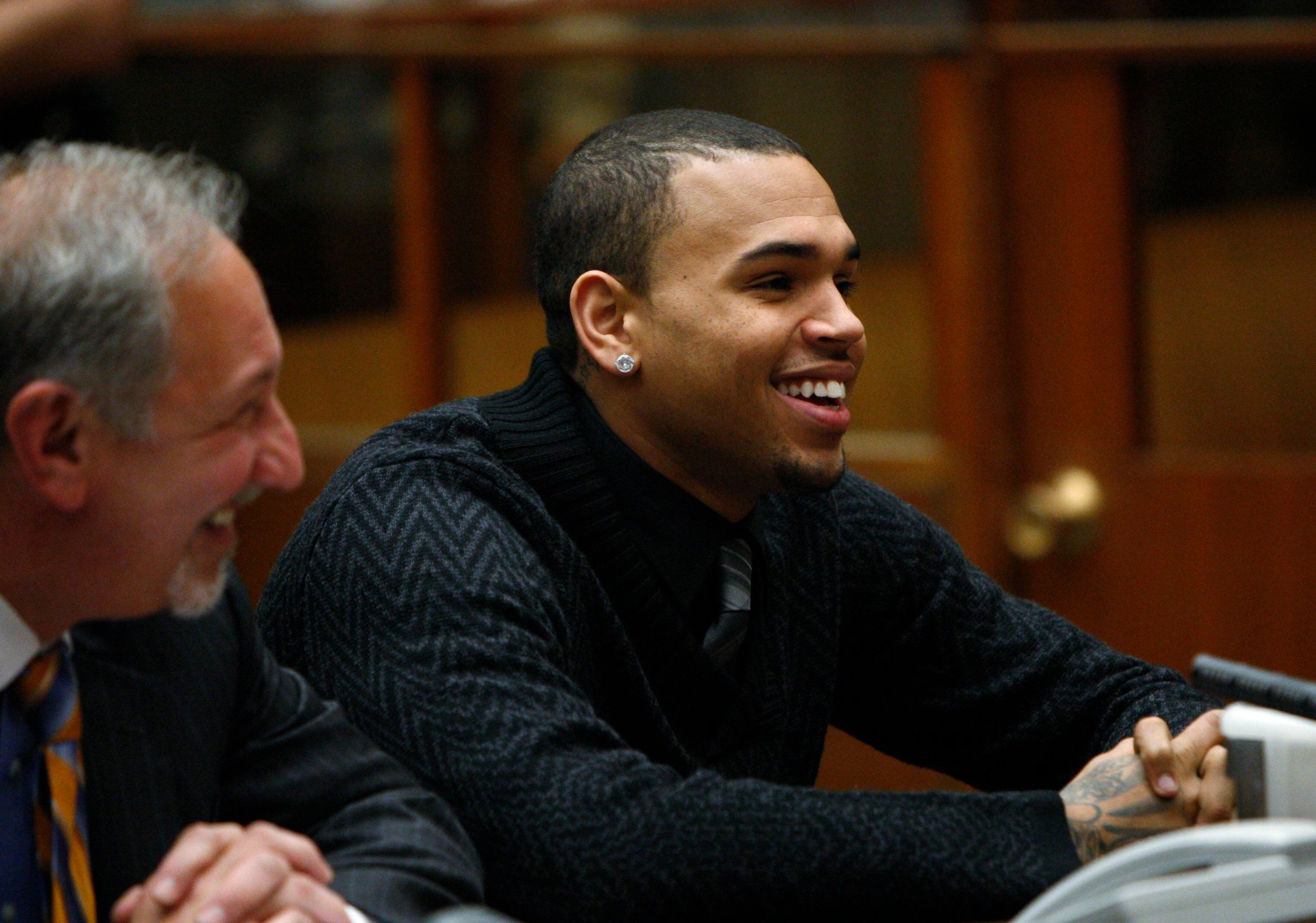 R&B singer Chris Brown appears for a progress report hearing in Los Angeles, Friday, Jan. 28, 2011. Brown pleaded guilty to assaulting his pop star girlfriend Rihanna in Hancock Park after a pre-Grammy Awards party in 2009. He was sentenced to five years probation, ordered to complete 180 days of community labor and a year of domestic violence counseling. (AP Photo/David McNew, Pool)