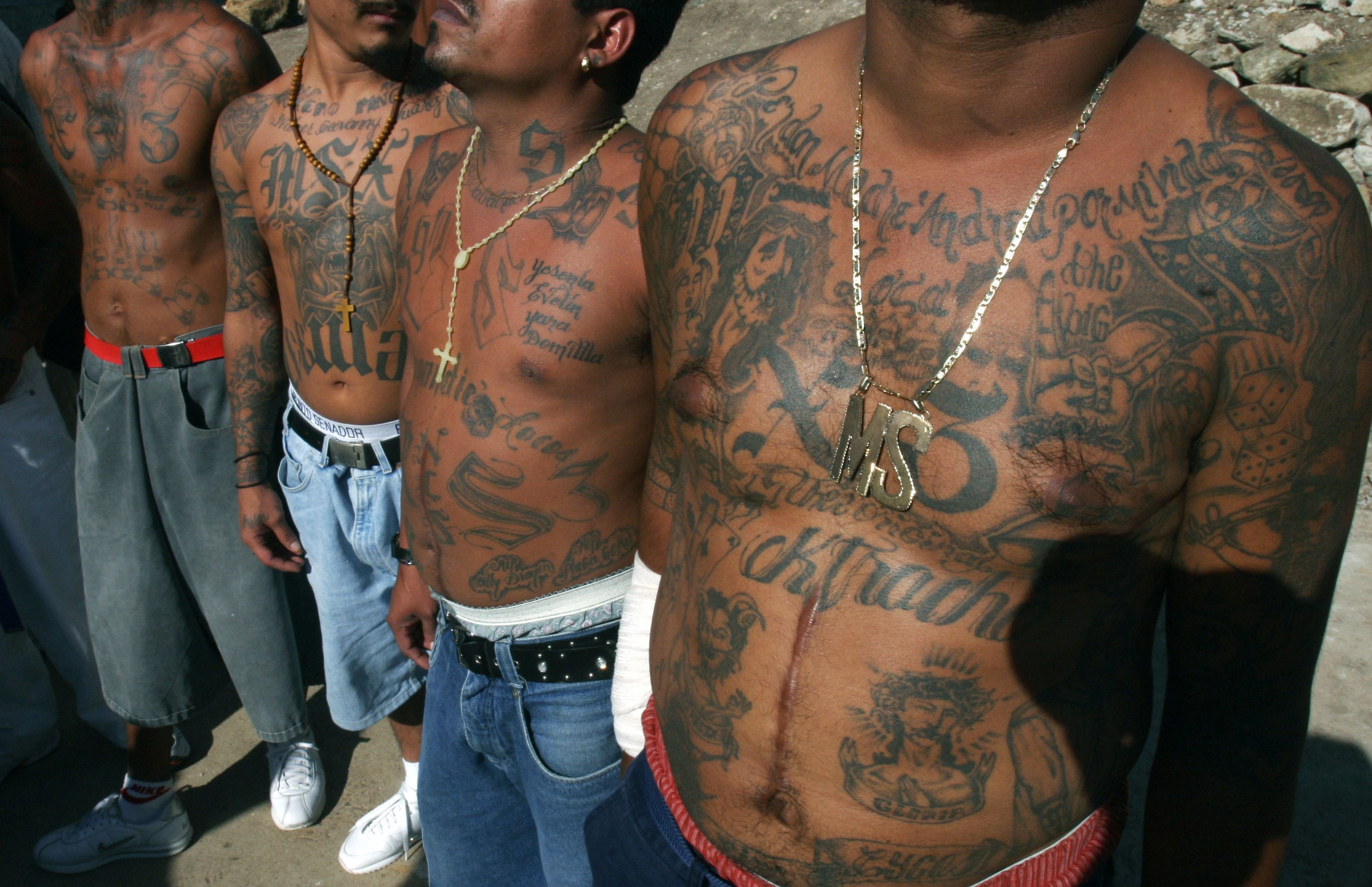 FILE - In this Nov.24, 2005 file photo shows unidentified members of the gang Mara Salvatrucha who are incarcerated in the National Penitentiary of Tamara, in Tegucigalpa, Honduras. The deadliest prison blaze in a century has drawn attention to an unfortunate U.S. export to Central America, street gangs. Prisons in Honduras and elsewhere in Central America are teeming with inmates who belong to gangs that have their roots in Southern California. Refugees of the regions civil wars sowed a new breed of violence on the streets of Los Angeles in the 1980s. (AP Photo/Esteban Felix,File)