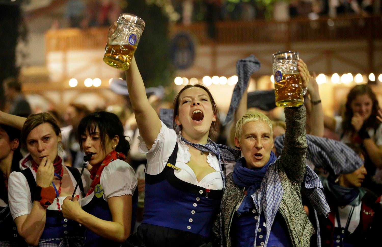 Waitresses dance on tables in a beer tent on the final evening of the famous Bavarian "Oktoberfest" beer festival in Munich, southern Germany, Sunday, Oct. 7, 2012. (AP Photo/Matthias Schrader)