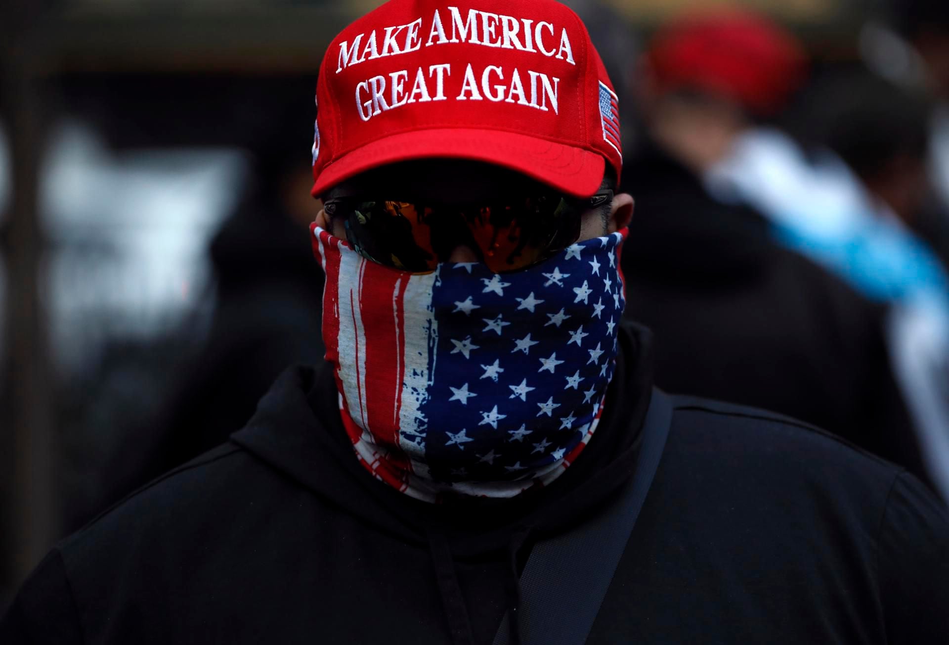 New York (United States), 20/03/2023.- A Trump supporter attends a rally held by the New York Young Republicans outside of New York Criminal Court at a rally for Former President Donald Trump in New York, New York, USA, 20 March 2023. Former President Donald J. Trump posted on his social media platform that he expects to be formally indicted on 21 March, the Manhattan District Attorney's office investigating charges related to hush-money payments to porn star Stormy Daniels has declined to comment on any potential indictment. (Estados Unidos, Nueva York) EFE/EPA/Peter Foley
