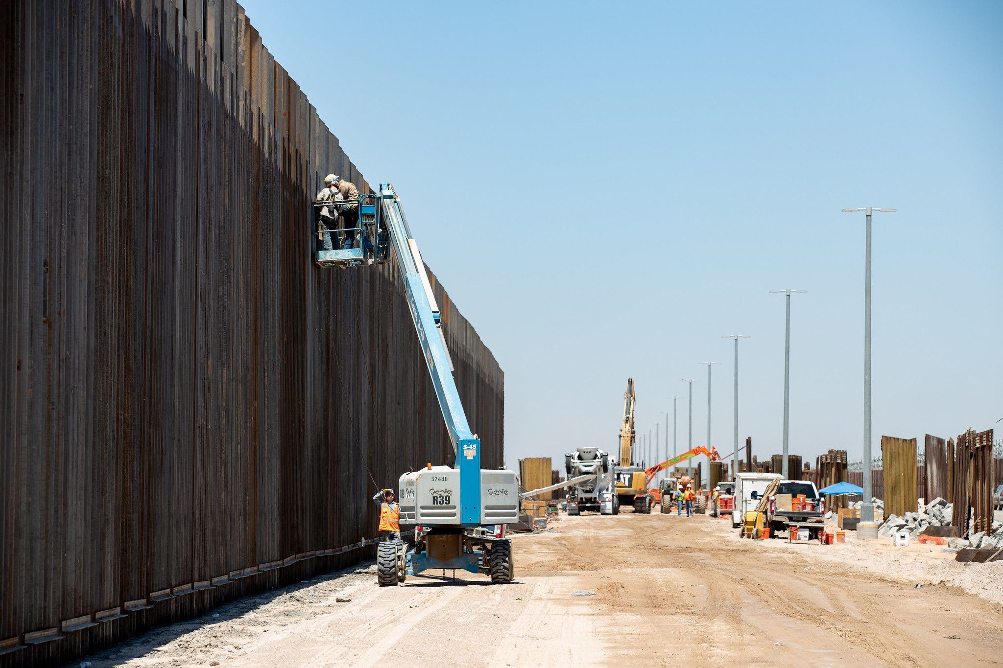 Photograph showing new bollard wall constructed in place of antiquated infrastructure, near Yuma, AZ on Tuesday, July 16, 2019.  U.S. Customs and Border Protection photo by Jerry Glaser