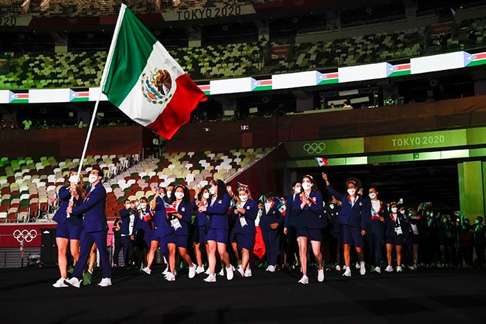 TOKYO, JAPAN - JULY 23: Flag bearers Gabriela Lopez and Rommel Pacheco Marrufo of Team Mexico during the Opening Ceremony of the Tokyo 2020 Olympic Games at Olympic Stadium on July 23, 2021 in Tokyo, Japan. (Photo by Jamie Squire/Getty Images)