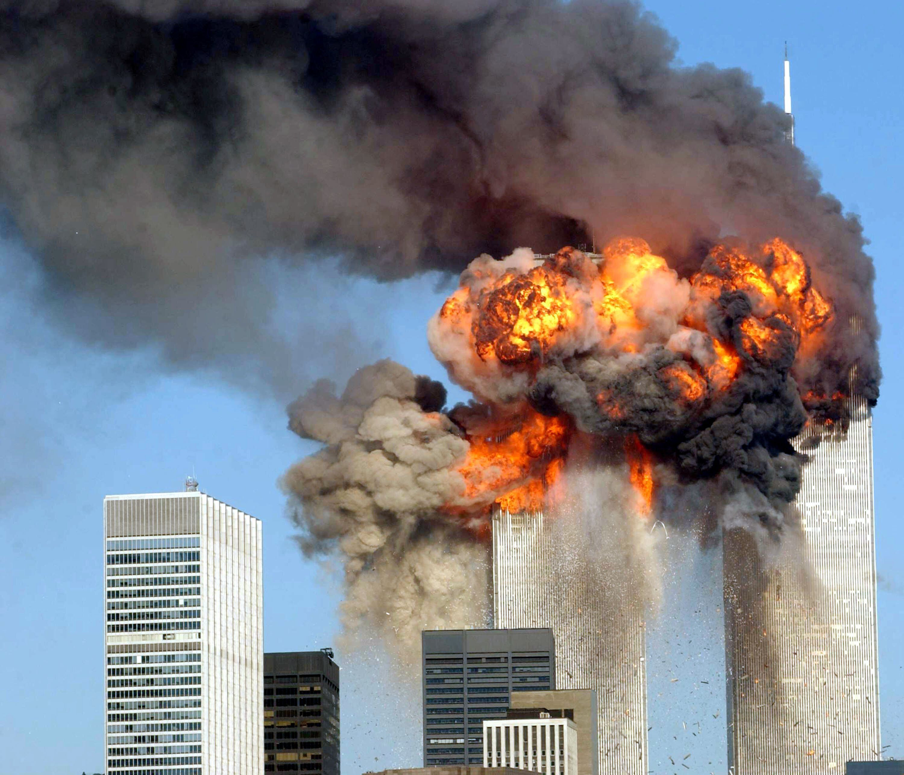 394261 12:  (GERMANY OUT/NEWSWEEK OUT/US NEWS&WORLD REPORT OUT)   A fiery blasts rocks the World Trade Center after being hit by two planes September 11, 2001 in New York City.  (Photo by Spencer Platt/Getty Images)