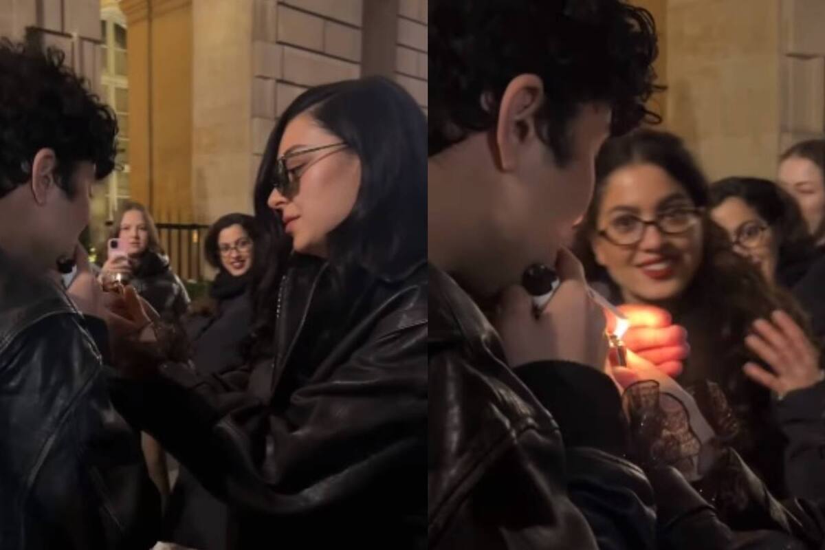 Charli xcx le prende un cigarrillo a un fan en París