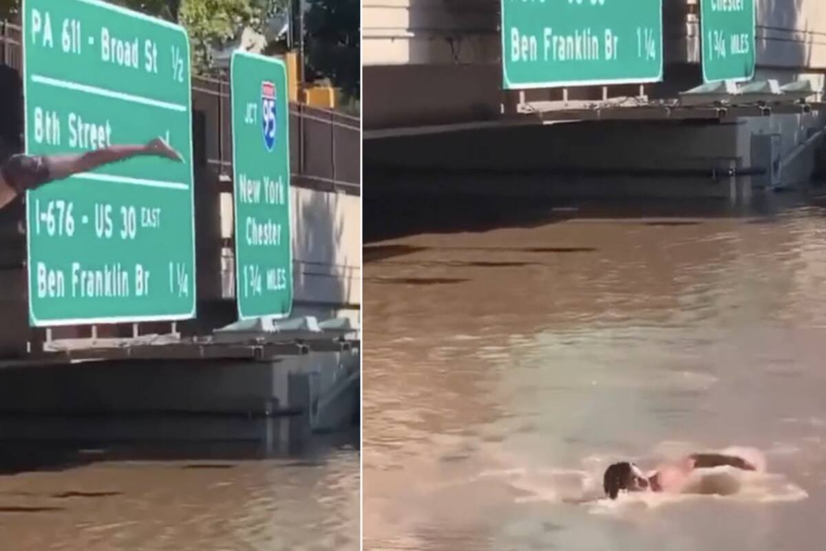 Salta de espalda en las aguas que inundan carretera en Filadelfia