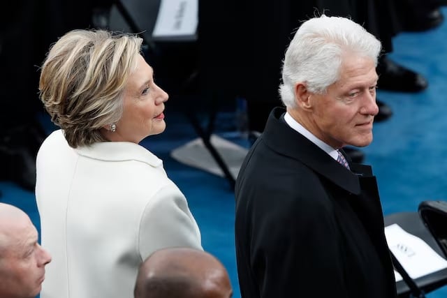 Former U.S. President Bill Clinton arrives with his wife, former presidential candidate Hillary Clinton for the inauguration ceremonies swearing in Donald Trump as the 45th president of the United States on the West front of the U.S. Capitol in Washington, U.S., January 20, 2017. REUTERS/Brian Snyder