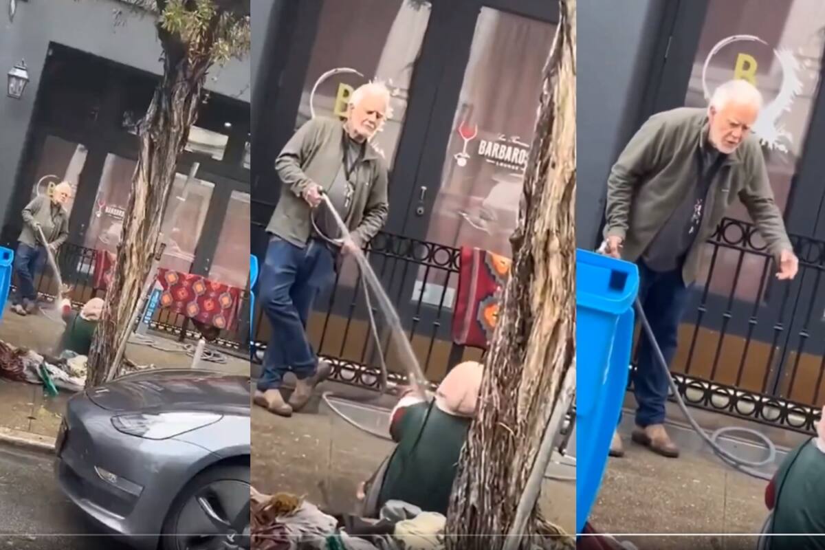 VIDEO: hombre corre a una indigente de la acera al dispararle agua a presión