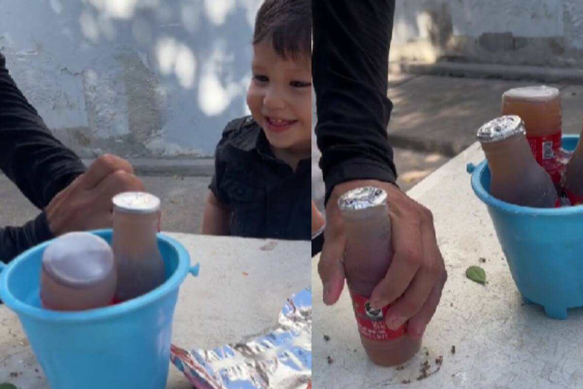 Padre le sirve jugo y frituras a su hijo, como si estuviera en una cantina