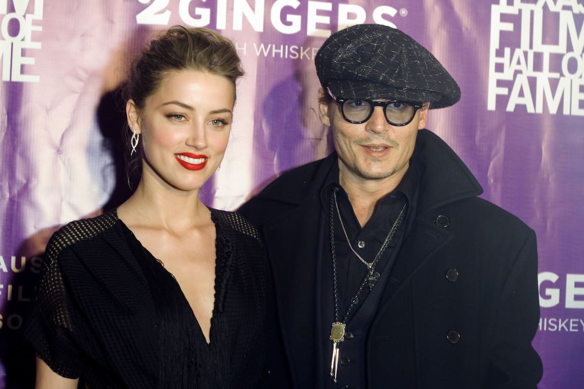 Amber Heard and Johnny Depp arrive at the Texas Film Awards on Thursday, March 6, 2014 in Austin, Texas. The Austin Film Society honored Heard, who is from Austin, with the Rising Star Award. (Photo by Jack Plunkett/Invision/AP)