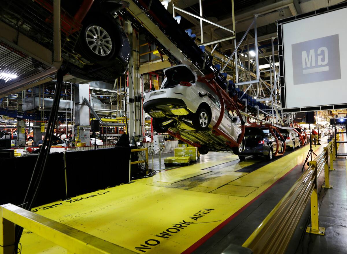 FILE - In this Monday, Jan. 28, 2013, file photo, cars move along an assembly line at the General Motors Fairfax plant in Kansas City, Kan. General Motors is extending the normal two-week summer shutdown at two U.S. car factories because of slumping demand. Union officials say the Lordstown, Ohio, plant near Cleveland and the Fairfax plant in Kansas City, Kan., will close for as long as five weeks in June and July 2017. (AP Photo/Orlin Wagner, File)
