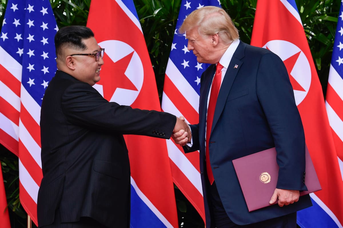 FILE - In this June 12, 2018, file photo, North Korean leader Kim Jong Un, left, and U.S. President Donald Trump shake hands at the conclusion of their meetings at the Capella resort on Sentosa Island in Singapore. U.S. analysts say they have located more than half of an estimated 20 secret North Korean missile development facilities. The findings come as the Trump administration’s denuclearization talks with the North appear to have stalled. And they highlight the challenge the U.S. faces in ensuring that North Korea complies with any eventual agreement that covers its nuclear and missile programs. (AP Photo/Susan Walsh, Pool, File)