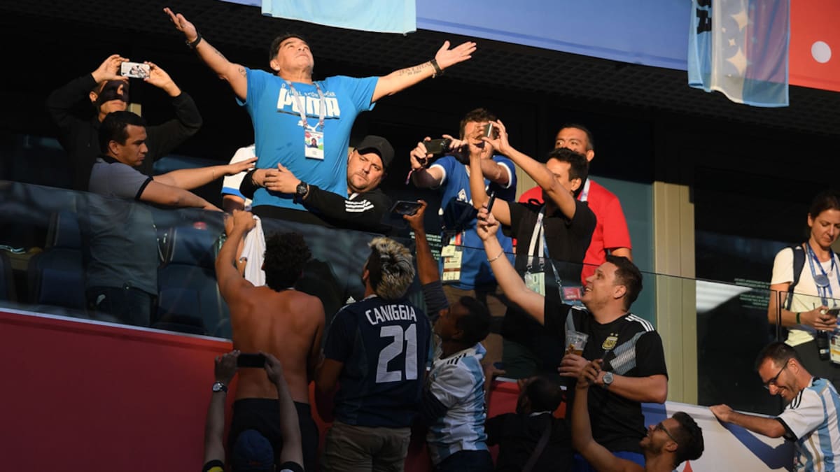 TOPSHOT - Retired Argentina player Diego Maradona gestures ahead of the Russia 2018 World Cup Group D football match between Nigeria and Argentina at the Saint Petersburg Stadium in Saint Petersburg on June 26, 2018. (Photo by OLGA MALTSEVA / AFP) / RESTRICTED TO EDITORIAL USE - NO MOBILE PUSH ALERTS/DOWNLOADS (Photo credit should read OLGA MALTSEVA/AFP via Getty Images)