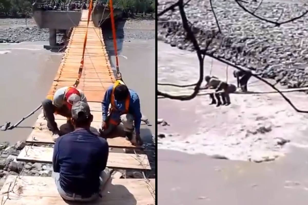 Veracruz: Usando troncos, tablas y cuerdas vecinos de Tzicatlán construyen puente colgante para cruzar el río que lo destruyó la reciente lluvia
