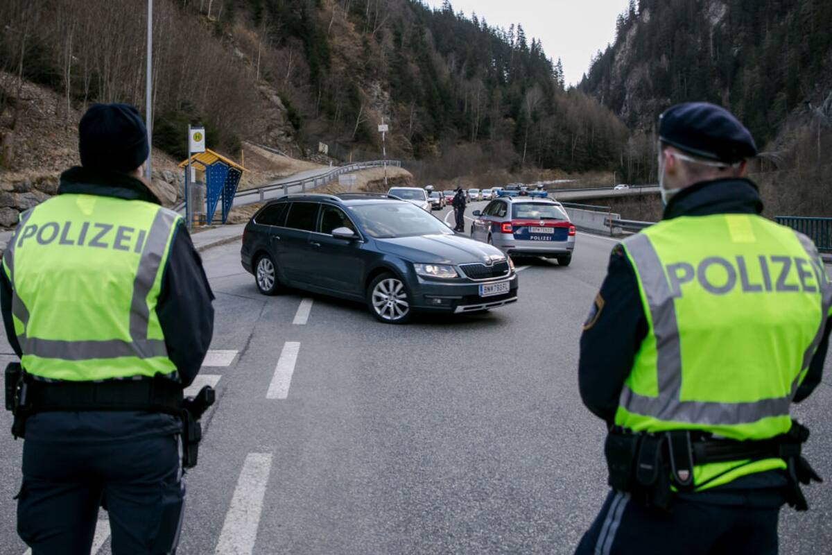 ISCHGL, AUSTRIA - MARCH 13: Police at a roadblock stop cars from driving out of the Panznautal valley following the imposition of a quarantine due to the coronavirus on March 13, 2020 near Ischgl, Austria. The ski resort towns of Sankt Anton and Ischgl are both under quarantine and many ski resorts in the region have been closed. The Austrian government is pursuing aggressive measures, including closing schools, cancelling events and shuttering shops except for grocery stores and pharmacies in an effort to slow the ongoing spread of the coronavirus. (Photo by Jan Hetfleisch/Getty Images)