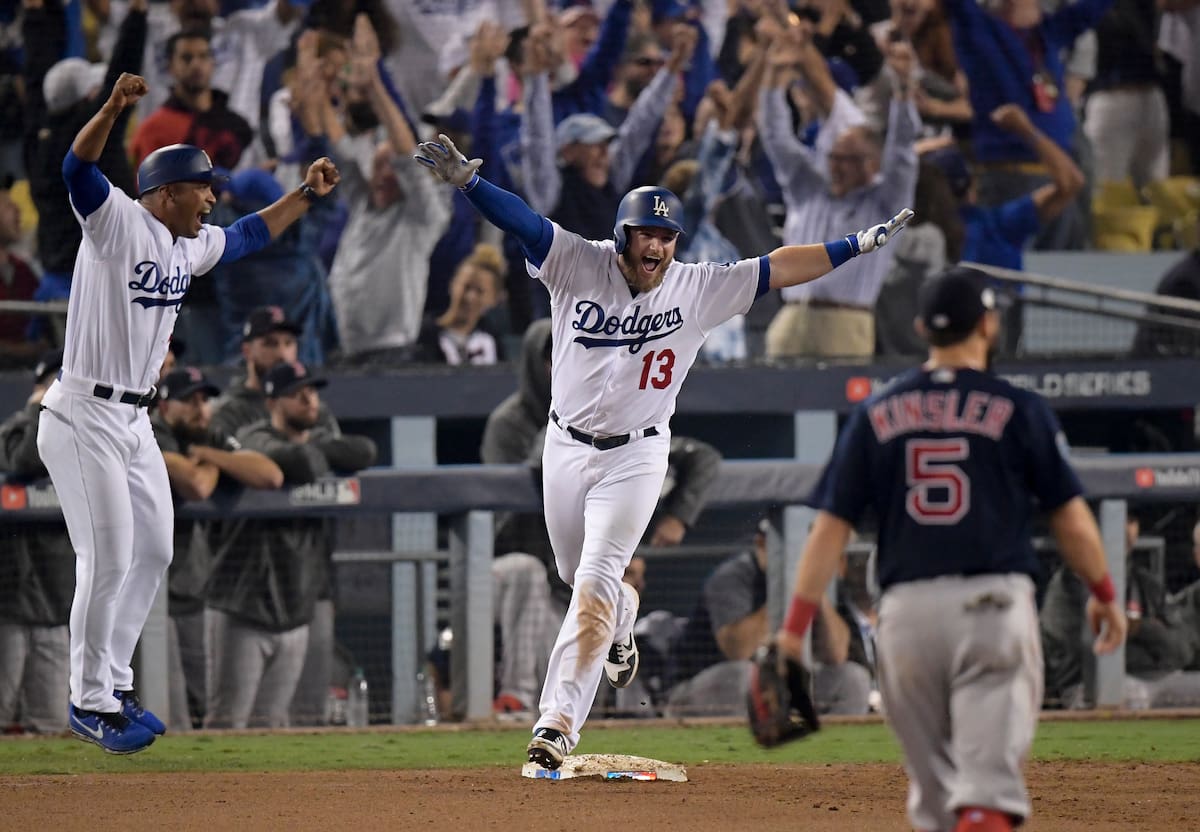 Los Angeles Dodgers first baseman Max Muncy (13) celebrates after his walk off home run against the Boston Red Sox during the 18th inning in Game 3 of the World Series baseball game on Saturday, Oct. 27, 2018, in Los Angeles. (AP Photo/Mark J. Terrill)