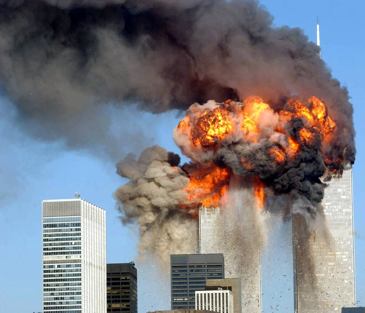 394261 12: (GERMANY OUT/NEWSWEEK OUT/US NEWS&WORLD REPORT OUT) A fiery blasts rocks the World Trade Center after being hit by two planes September 11, 2001 in New York City. (Photo by Spencer Platt/Getty Images)
