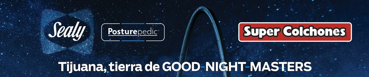 2BRH7R9 Avenida Revolucion (Revolution street) with the millennial arch (el arco y reloj monumental) at dusk. Tijuana, Mexico