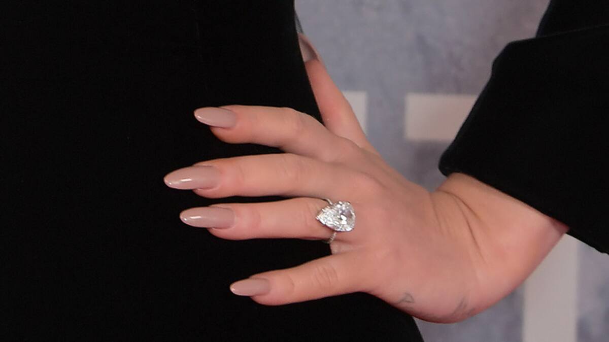 LONDON, ENGLAND - FEBRUARY 08: (EDITORIAL USE ONLY) Adele, ring detail, arrives at The BRIT Awards 2022 at The O2 Arena on February 8, 2022 in London, England. (Photo by David M. Benett/Dave Benett/Getty Images)