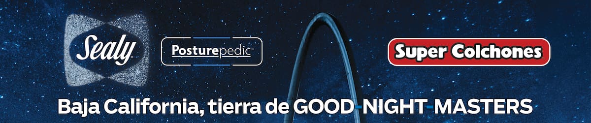 2BRH7R9 Avenida Revolucion (Revolution street) with the millennial arch (el arco y reloj monumental) at dusk. Tijuana, Mexico