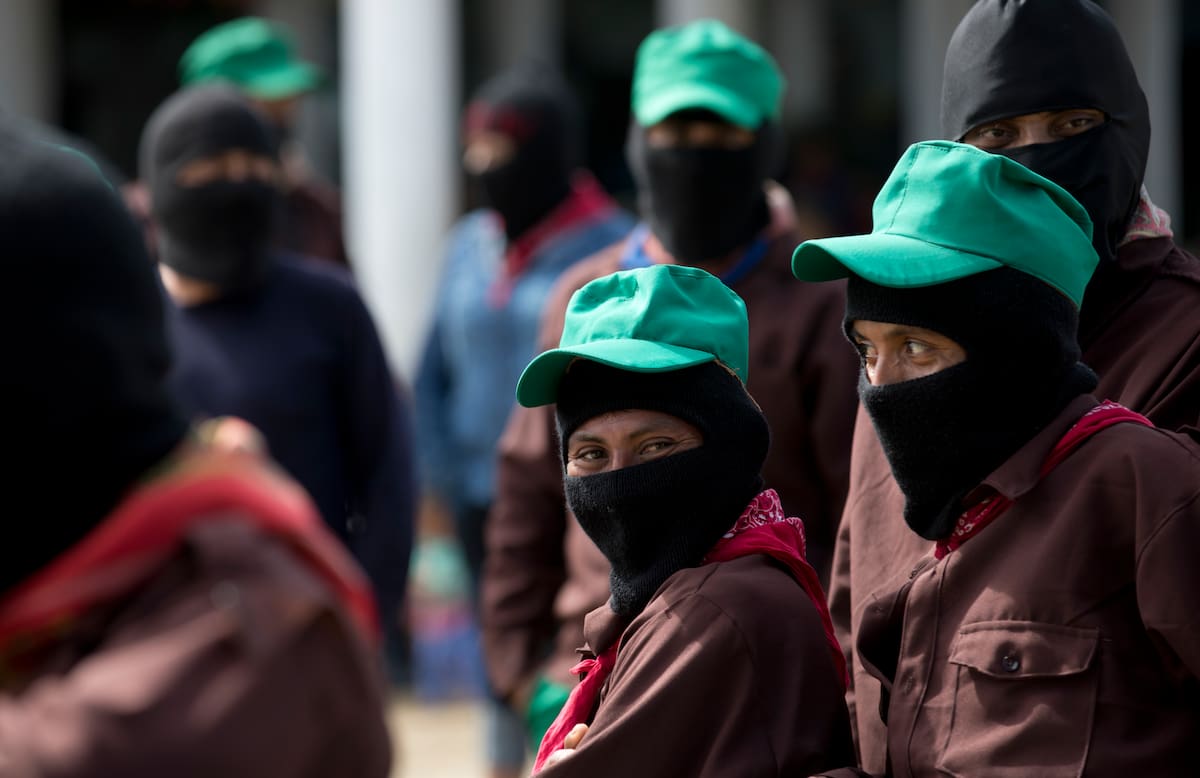 Members of the Zapatista National Liberation Army, EZLN, attend an event marking the 25th anniversary of the Zapatista uprising in La Realidad, Chiapas, Mexico, Tuesday, Jan. 1, 2019. Mexico's leftist Zapatistas have continued their aggressive criticism of the country's new president, accusing Andres Manuel Lopez Obrador of dishonesty and vowing to confront him. (AP Photo/Eduardo Verdugo)
