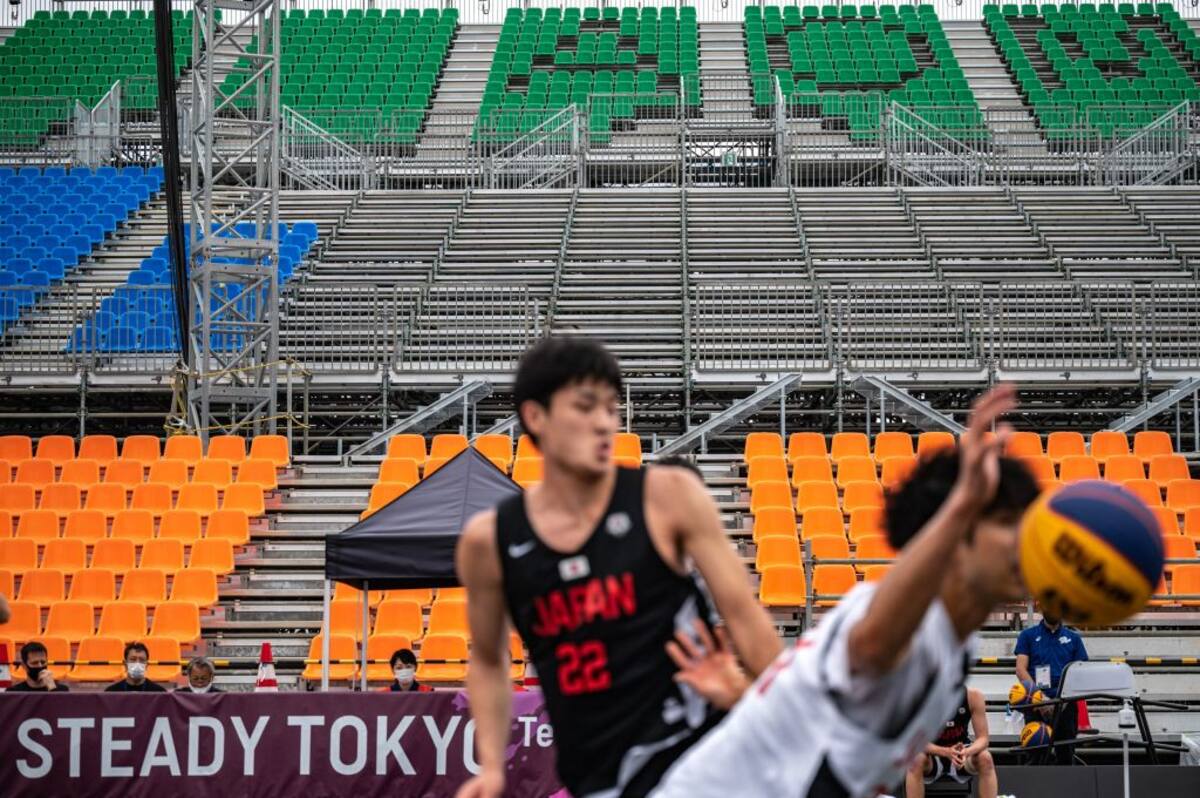 Empty seats are seen in the men's semi final match between team Japan B and D during a 3X3 basketball test event for the 2020 Tokyo Olympics at Aomi Urban Sports Park in Tokyo on May 16, 2021. (Photo by Philip FONG / AFP) (Photo by PHILIP FONG/AFP via Getty Images)