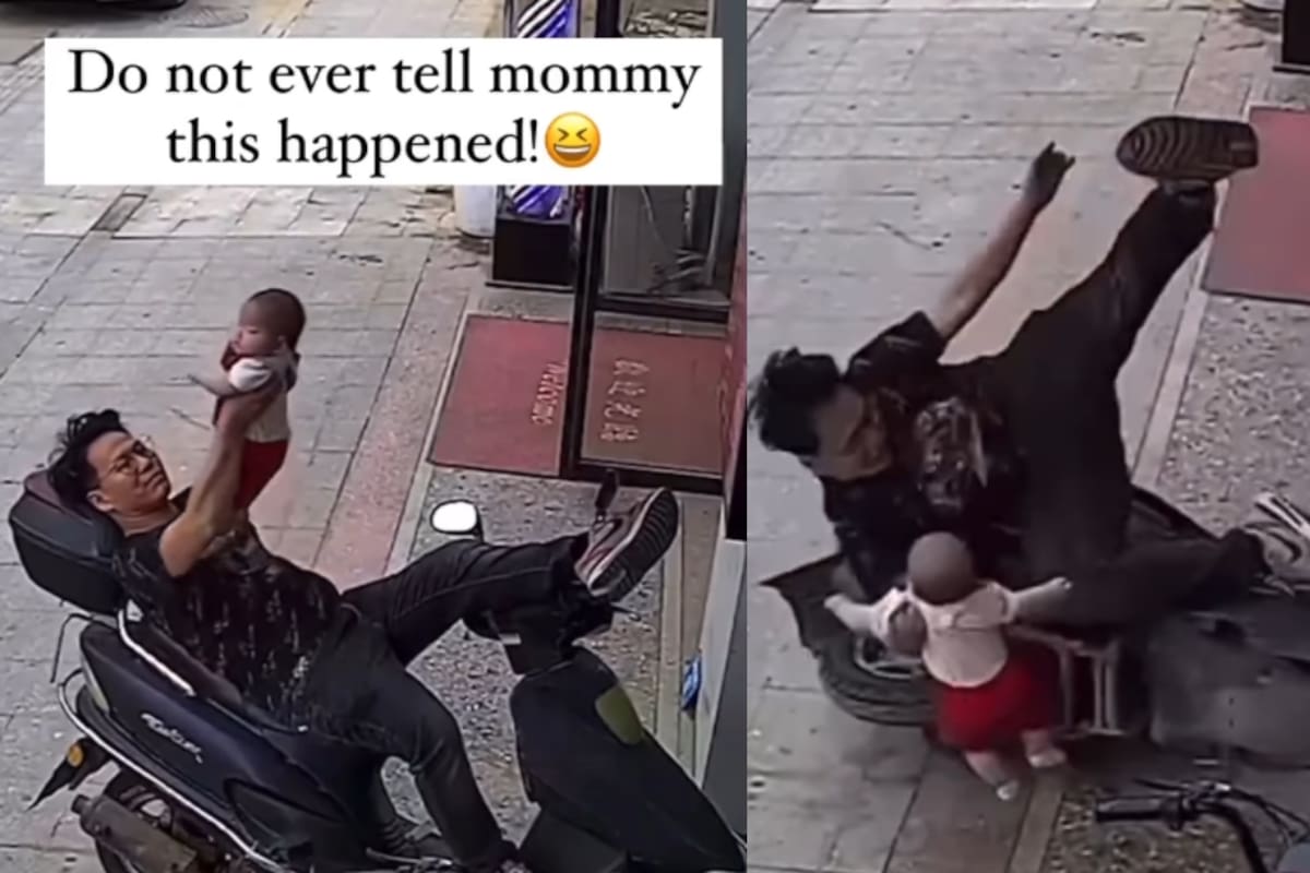 Hombre recostado en una moto con su bebé en brazos pierde el equilibrio y cae junto a su hijo