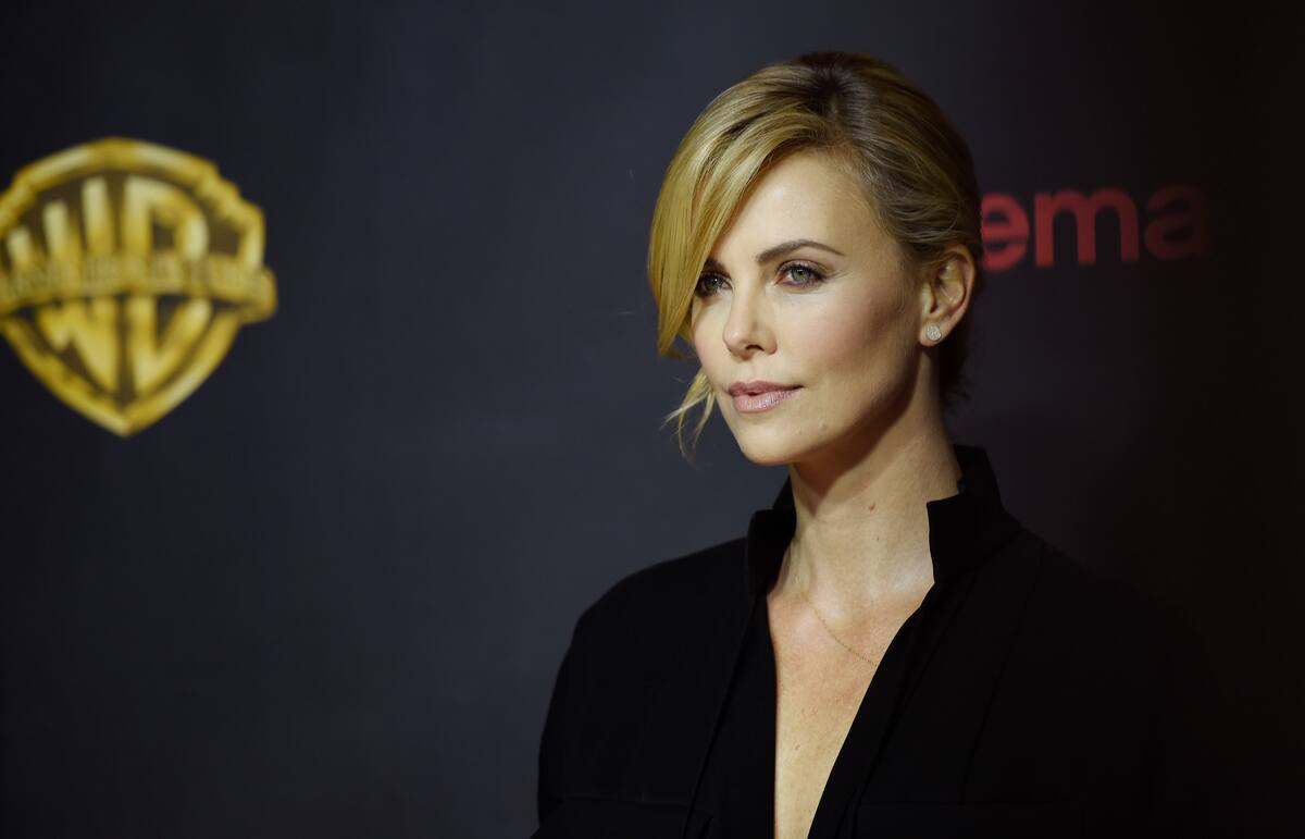 Charlize Theron, a cast member in "Mad Max: Fury Road," poses before the Warner Bros. presentation during CinemaCon 2015 at Caesars Palace on Tuesday, April 21, 2015, in Las Vegas. (Photo by Chris Pizzello/Invision/AP)