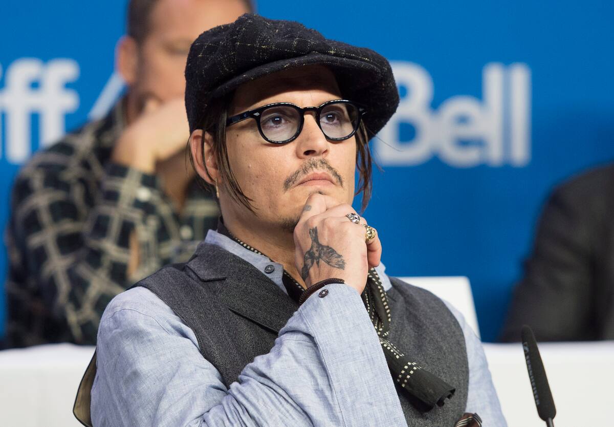 Actor Johnny Depp appears at a press conference promoting the film "Black Mass" during the 2015 Toronto International Film Festival in Toronto on Monday, Sept. 14, 2015. (Darren Calabrese/The Canadian Press via AP)