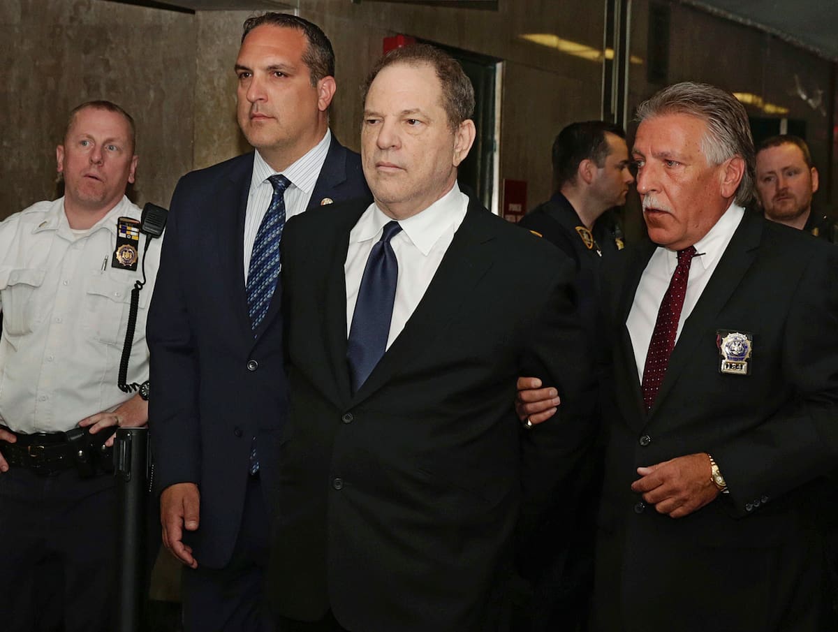 Harvey Weinstein is escorted in handcuffs to a courtroom in New York, Monday, July 9, 2018. Weinstein, who was previously indicted on charges involving two women, was due in court for arraignment on charges alleging he committed a sex crime against a third woman. (AP Photo/Richard Drew)