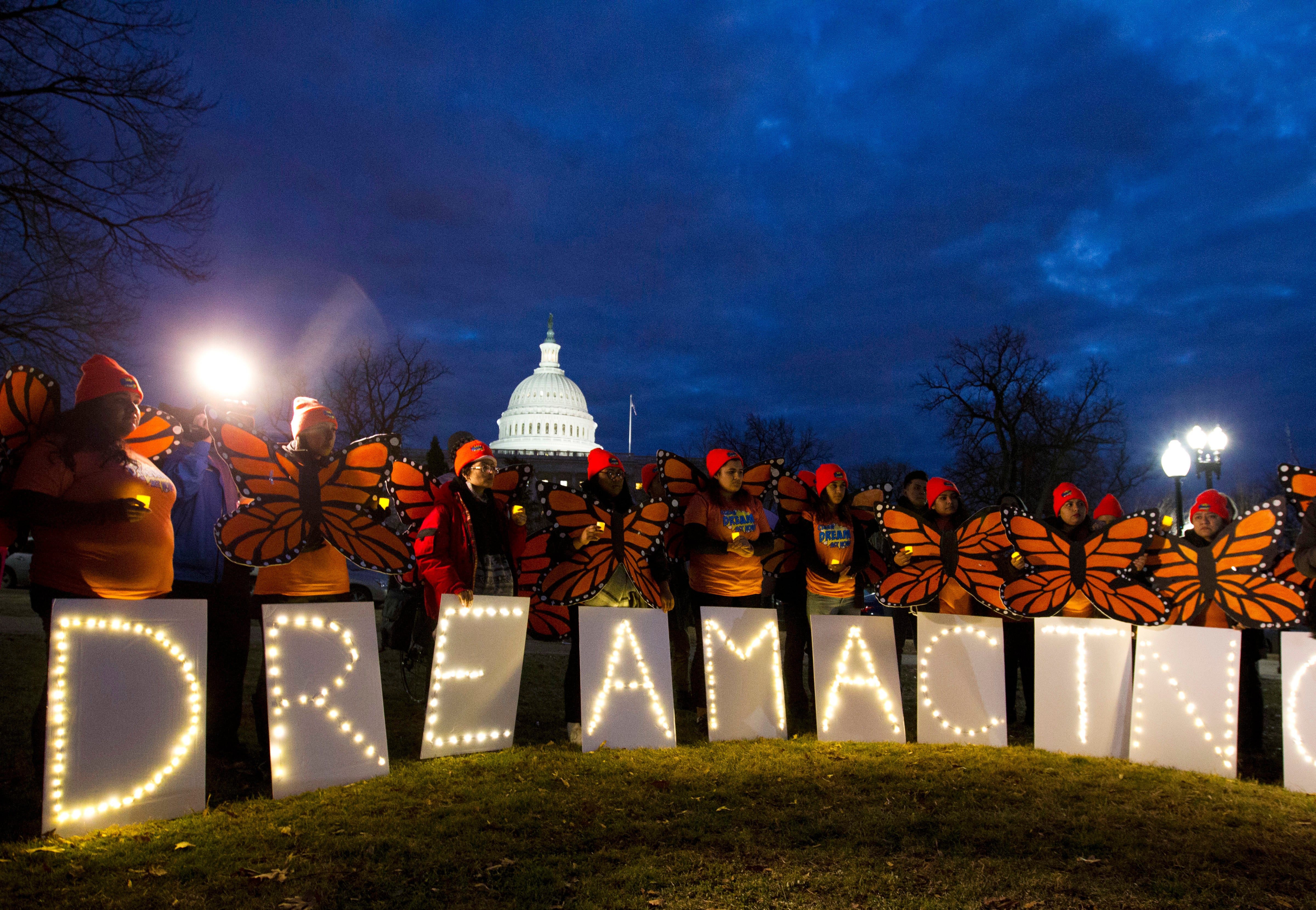 Demonstrators rally in support of Deferred Action for Childhood Arrivals (DACA) outside the Capitol, Sunday, Jan. 21, 2018, in Washington, on the second day of the federal shutdown. Democrats have been seeking a deal to protect the