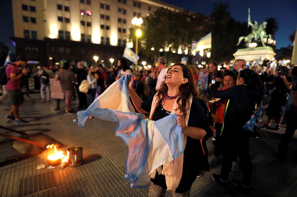 epa09142376 People gather to protest against the government of President Alberto Fernandez , in Plaza de Mayo, in front of the Casa Rosada, Buenos Aires, Argentina 17 April 2021. Citizens in Buenos Aires protest against the new restrictions dictated by the Argentine government, especially the suspension of classes in schools, to face the second wave of covid-19. EPA/Juan Ignacio Roncoroni