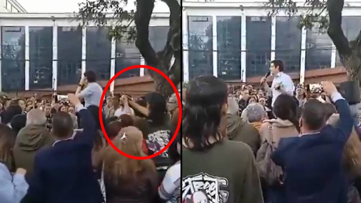 El muchacho estaba escuchando a Turbay en su alocución. En este momento hablaba sobre el porte de armas y se puso a conversar con algunos de los asistentes al evento. Foto: Capture.