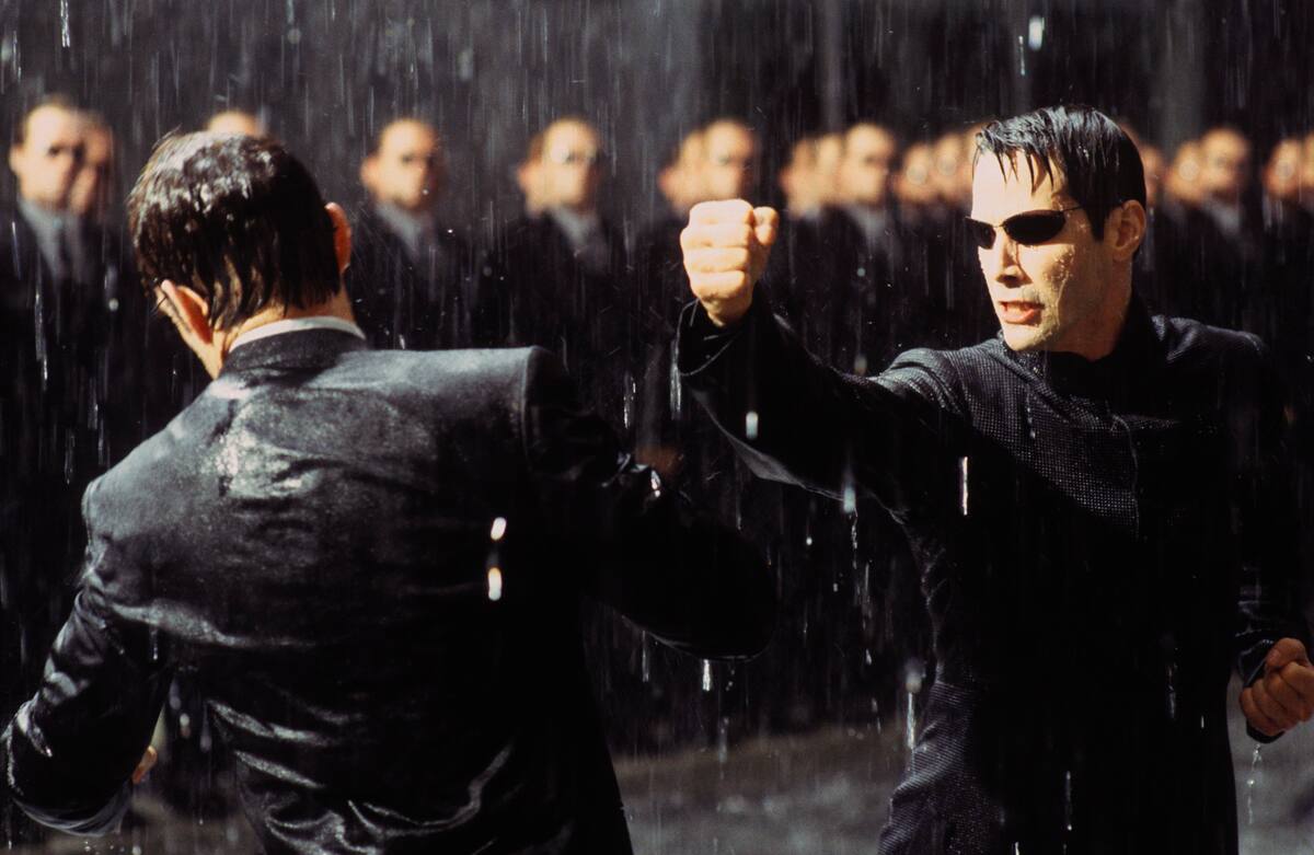 Actors Keanu Reeves, right, and Hugo Weaving appear in a fight scene from Warner Bros. Pictures action thriller "The Matrix Reloaded," in this undated promotional photo. The Sept. 11 attacks and the war against terrorism that led to conflicts in Afghanistan and Iraq have left audiences more primed than ever for big-screen heroes such as those in "The Matrix" and "X-Men" franchises. (AP Photo/Warner Bros. Pictures)