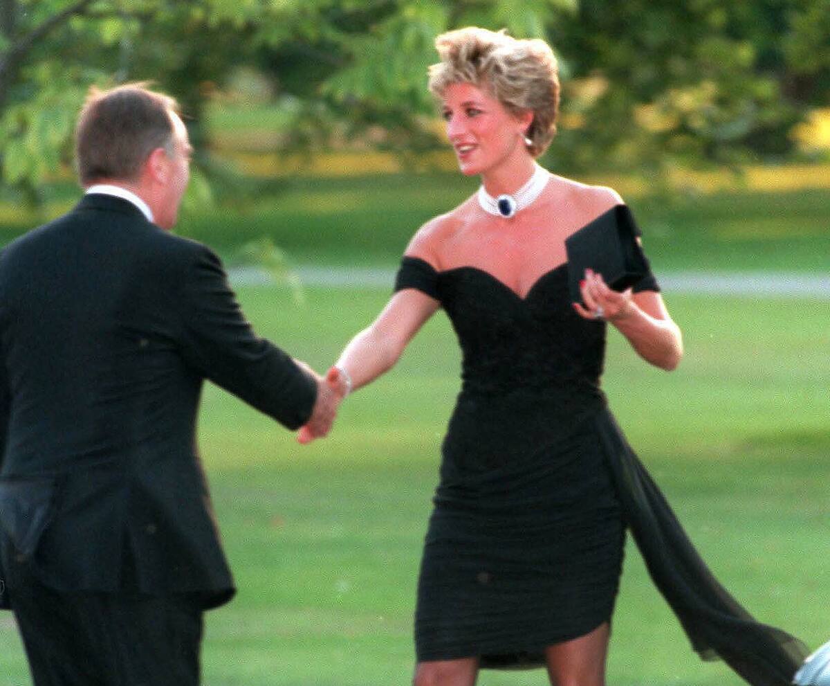 LONDON - NOVEMBER 20: Diana, Princess of Wales, wearing a stunning black dress commissioned from Christina Stambolian, attends the Vanity Fair party at the Serpentine Gallery on November 20, 1994 in London, England. The famous black "revenge dress" was a spectacular coup by the Princess, worn on the very evening that Prince Charles made his notorious adultery admission on television. (Photo by Anwar Hussein/WireImage)