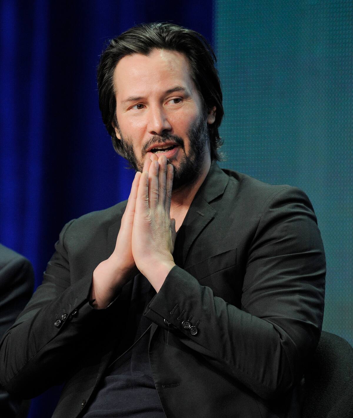 Keanu Reeves, host and producer of the documentary film "Side By Side," ponders a question during the PBS Summer 2013 TCA press tour at the Beverly Hilton Hotel on Tuesday, Aug. 6, 2013, in Beverly Hills, Calif. (Photo by Chris Pizzello/Invision/AP)