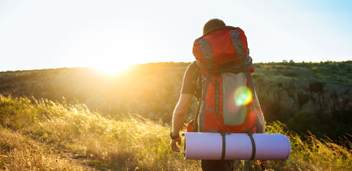 Couple family traveling together,Tourist couple Backpack along mountains and coast, freedom and active lifestyle concept