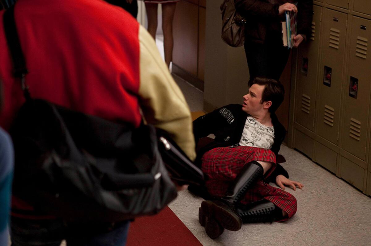 GLEE: Kurt (Chris Colfer, R) is pushed to the ground by one of the school bullies in the "Never Been Kissed" episode of GLEE airing Tuesday, Nov. 9 (8:00-9:01 PM ET/PT) on FOX. (Photo by FOX Image Collection via Getty Images)