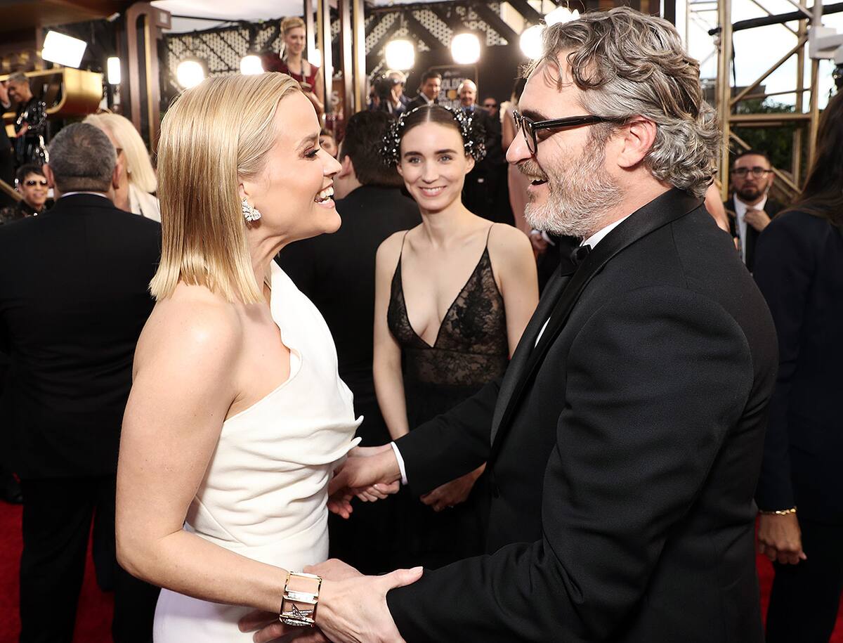 BEVERLY HILLS, CALIFORNIA - JANUARY 05: 77th ANNUAL GOLDEN GLOBE AWARDS -- Pictured: (l-r) Reese Witherspoon, Rooney Mara, and Joaquin Phoenix arrive to the 77th Annual Golden Globe Awards held at the Beverly Hilton Hotel on January 5, 2020. -- (Photo by: Todd Williamson/NBC/NBCU Photo Bank via Getty Images)