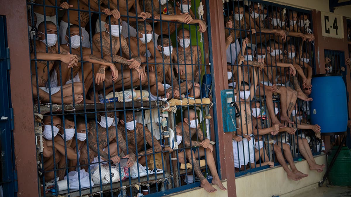Members of the MS-13 and 18 gangs remain in an overcrowded cell at the Quezaltepeque prison, in Quezaltepeque, El Salvador, on September 4, 2020. - Authorities from the General Directorate of Penal Centres (DGCP) visited three Salvadorean prisons, some of maximum security, to check the situation of inmates and carry out searches amid the COVID-19 novel coronavirus pandemic. (Photo by Yuri CORTEZ / AFP) (Photo by YURI CORTEZ/AFP via Getty Images)
