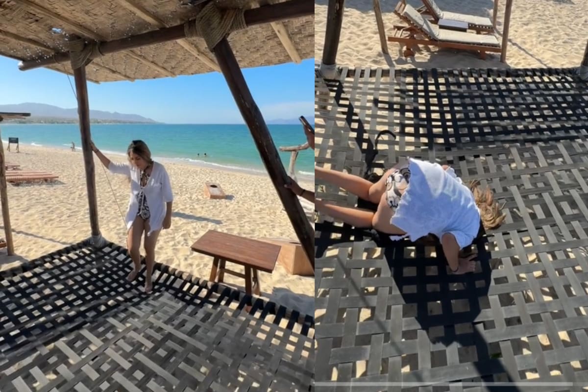 Mujer vive vergonzoso momento: se le atora la cabeza en una hamaca en la playa (VIDEO)