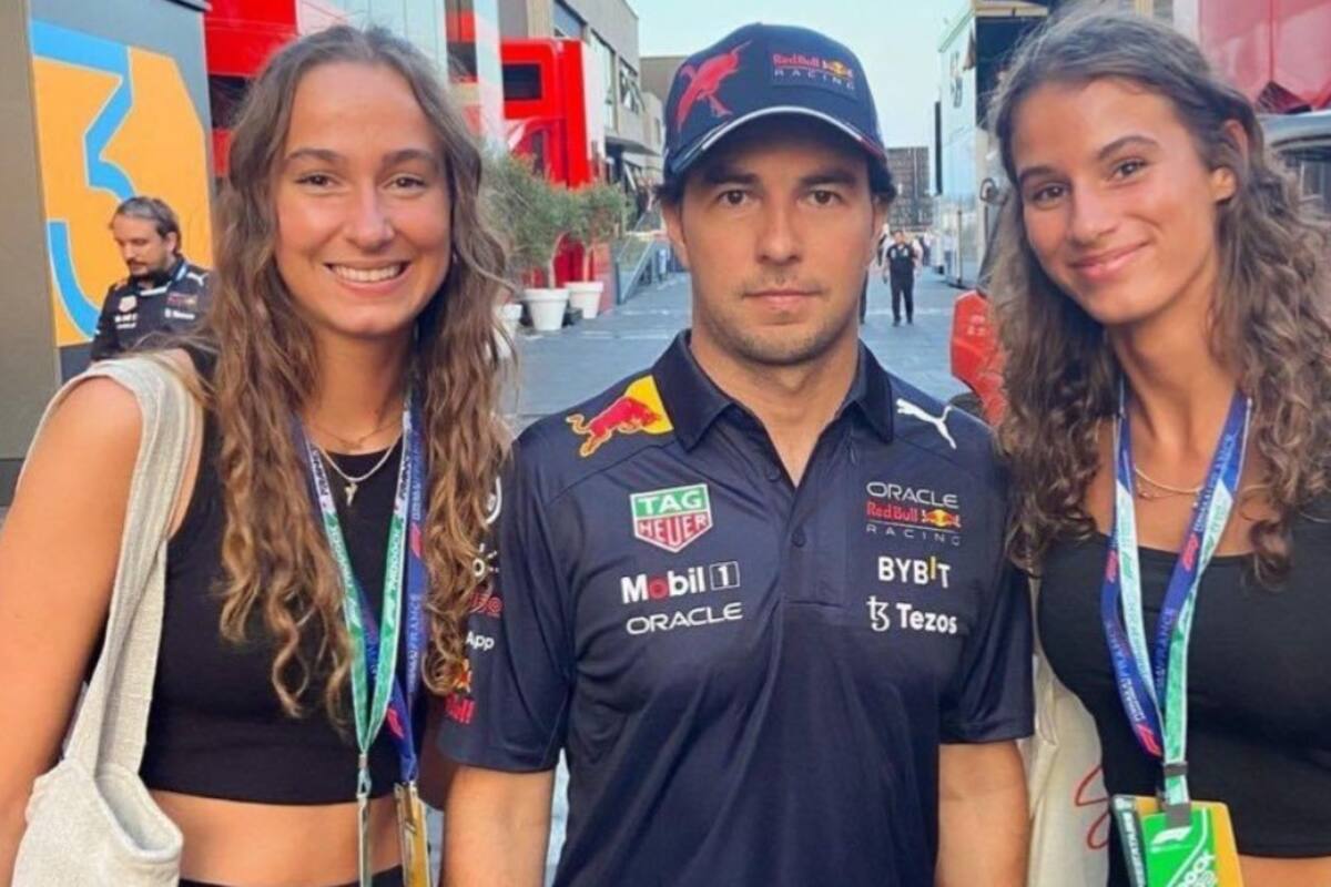 Checo Pérez evita contacto con mujeres en foto y redes creen que su pareja le puso ultimátum