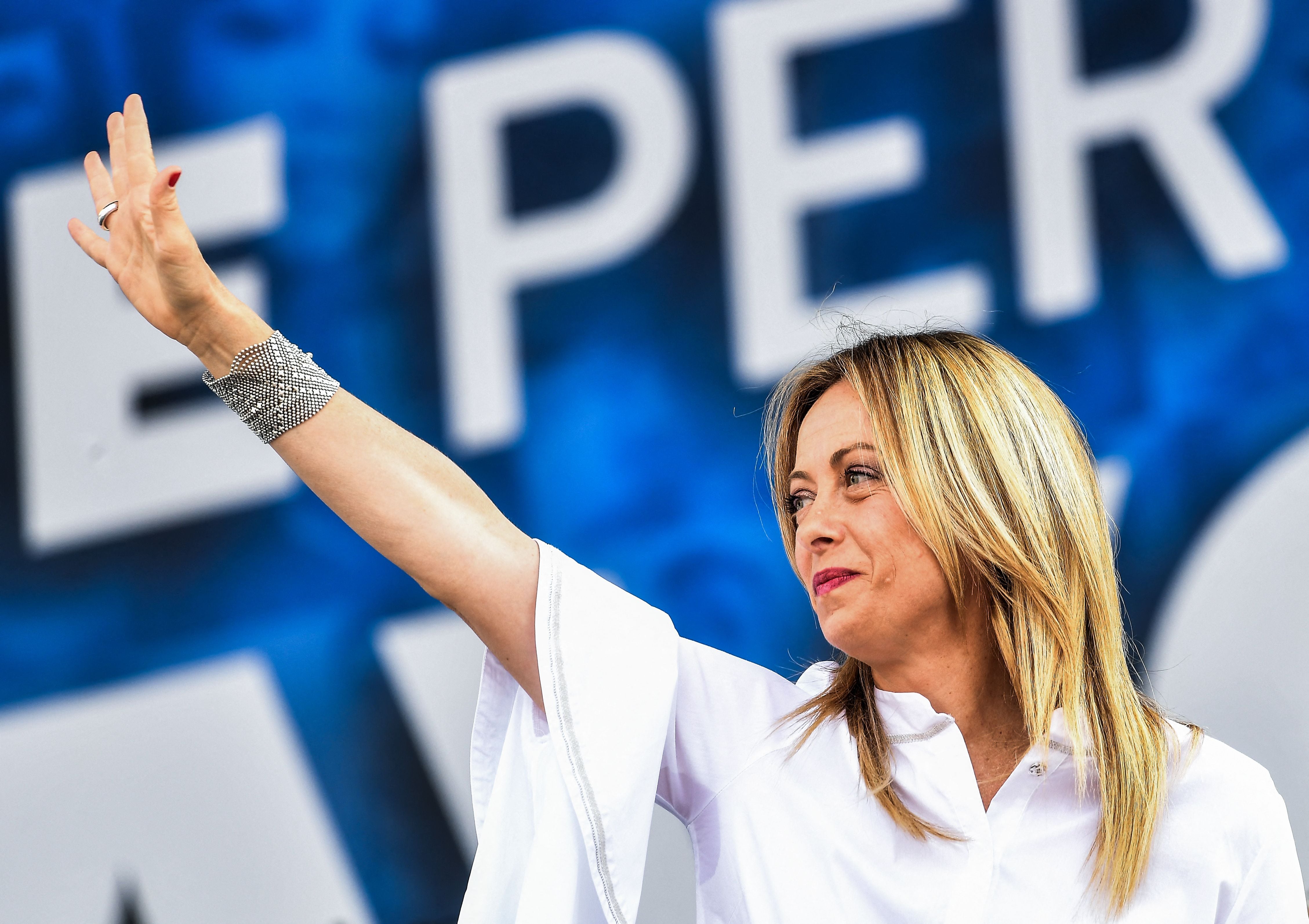 Head of the Brothers of Italy (FdI) party, Giorgia Meloni waves from the stage during a united rally of the League (Lega) party, the Brothers of Italy (FdI) party and the Forza Italia (FI) party for a protest against the government on July 4, 2020 on Piazza del Popolo in Rome, as the country eases its lockdown aimed at curbing the spread of the COVID-19 infection, caused by the novel coronavirus. (Photo by Tiziana FABI / AFP) (Photo by TIZIANA FABI/AFP via Getty Images)