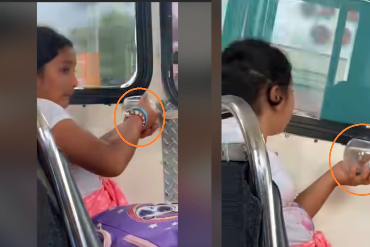 Niña se vuelve viral por viajar en camión con una pecera en las manos
