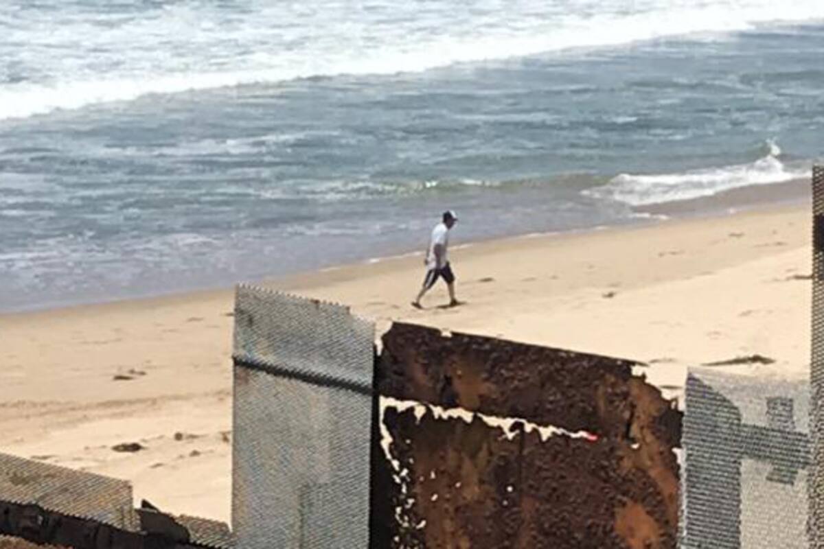 Migrante brinca el muro fronterizo a Estados Unidos