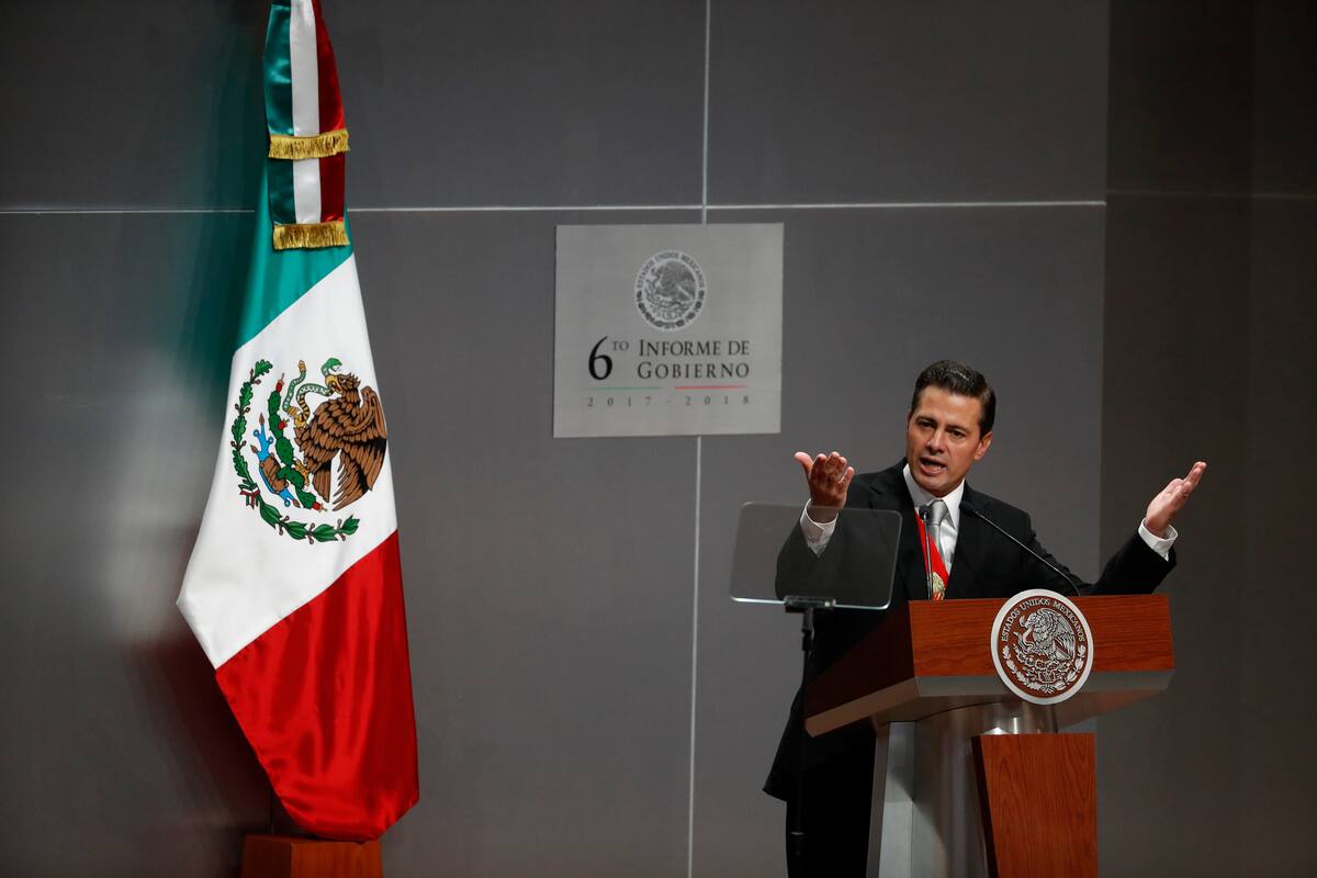Mexican President Enrique Pena Nieto delivers his sixth and final State of the Nation address at the National Palace in Mexico City, Monday, Sept. 3, 2018. President-elect and longtime opposition leader Andres Manuel Lopez Obrador will take over the reigns of power on December 1. (AP Photo/Rebecca Blackwell)