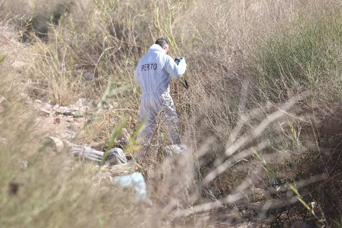 Localizan a embarazada muerta en lote baldío