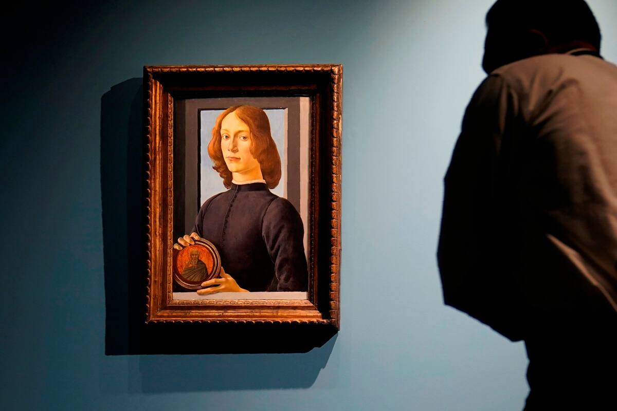FILE — In this Sept. 23, 2020 file photo, Sandro Botticelli's 15th-century painting called "Young Man Holding a Roundel" is displayed at Sotheby’s, in New York. The small painting sold at Sotheby's in New York on Thursday, Jan, 28, 2021, for $92.2 million, an auction record for the Renaissance master. (AP Photo/Seth Wenig, File)