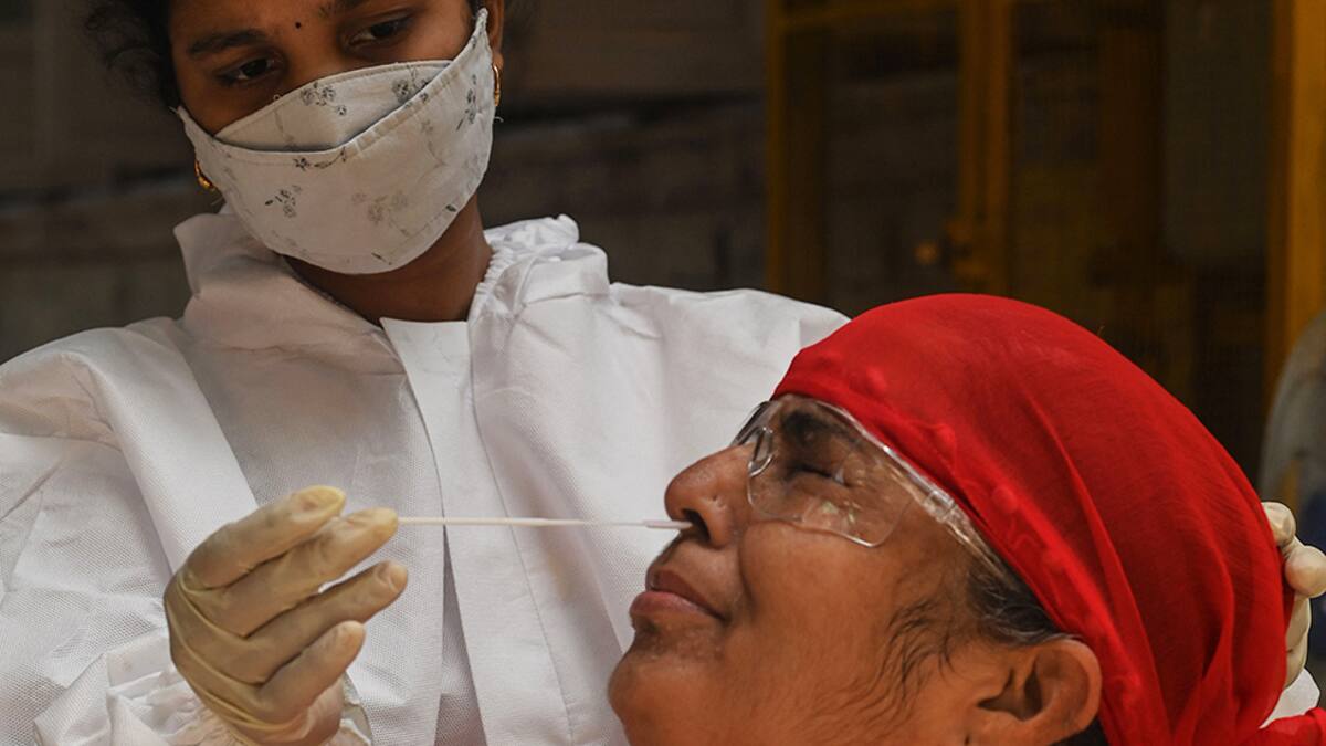 A medical staff takes a nasal swab for a Rapid Antigen Testing (RAT) test amidst rising Covid-19 coronavirus cases, in Mumbai on April 19, 2021. (Photo by INDRANIL MUKHERJEE / AFP) (Photo by INDRANIL MUKHERJEE/AFP via Getty Images)