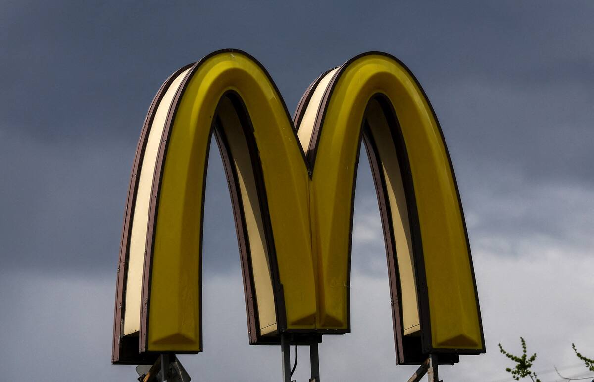 FILE PHOTO: A sign with the logo is on display outside a McDonald's restaurant in Moscow, Russia May 16, 2022. REUTERS/Evgenia Novozhenina